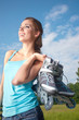 Rollerblade / roller skating woman in park