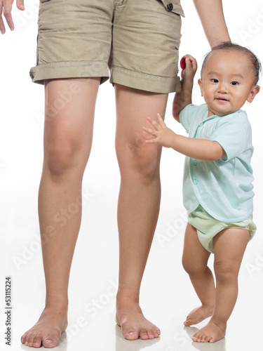 Photo: standing holding mom leg standing holding mom leg