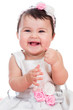 Portrait of smiling baby girl on a white background