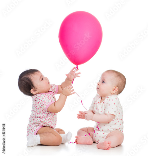 Photo: kids girls play red ballon isolated on white kids girls play red ballon isolated on white