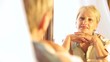 Senior woman looking into mirror