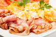 Closeup of scrambled eggs with bacon