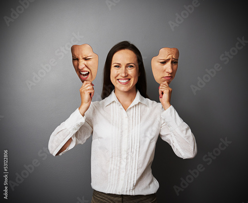 Photo: young beautiful woman hiding her good mood young beautiful woman hiding her good mood