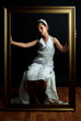Young girl with golden frame