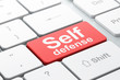 Illustration: Safety concept: Self Defense on computer keyboard background Safety concept: Self Defense on computer keyboard background
