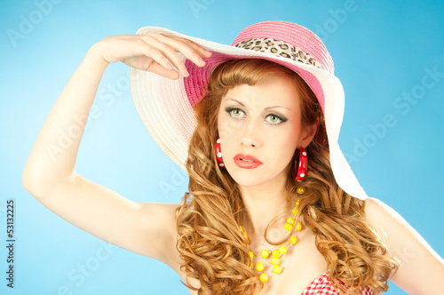 Photo: A large portrait of a cute red-haired girl in the pink sun hat A large portrait of a cute red-haired girl in the pink sun hat