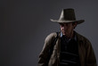 Portrait of a pensive man in a cowboy hat.