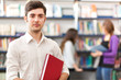Handsome young student in a library
