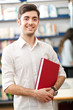 Handsome young student in a library