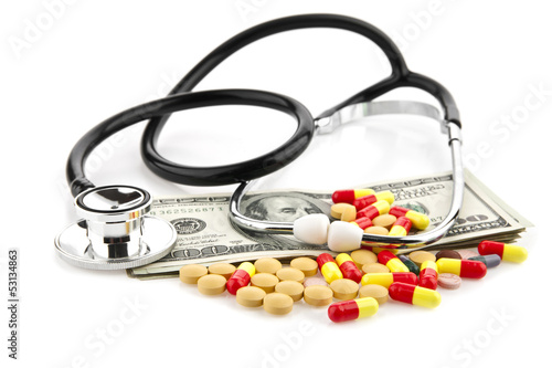 Photo: pills, dollars and stethoscope pills, dollars and stethoscope