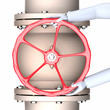 Hands on a red valve