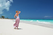 Girl on the desrt beach. Exuma, Bahamas