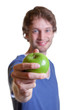 Young man offering an apple