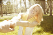 Happy woman whirling in park