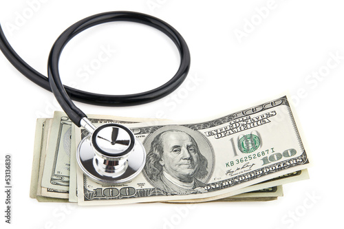Photo: stethoscope and dollars stethoscope and dollars