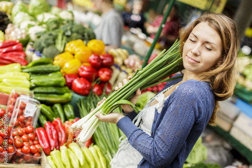 Photo: Young woman at the market Young woman at the market
