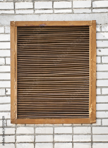 Photo: grate on a brick wall grate on a brick wall