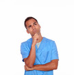 Pensive boy nurse standing with hand on chin