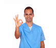 Handsome nurse showing positive sign with hand