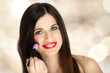 Photo: Woman applying make-up Woman applying make-up