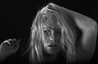 Confused woman with disheveled hair