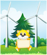 A cat holding an empty signboard in front of the windmills
