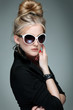 Photo: beautiful girl is in fashion style on grey beautiful girl is in fashion style on grey
