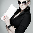 Photo: beautiful girl is in fashion style on grey beautiful girl is in fashion style on grey