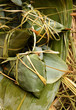 Foto: Rice dumpling on bamboo leaves Rice dumpling on bamboo leaves