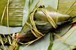 Foto: Rice dumpling on bamboo leaves Rice dumpling on bamboo leaves