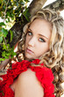 Beautiful girl standing at a tree