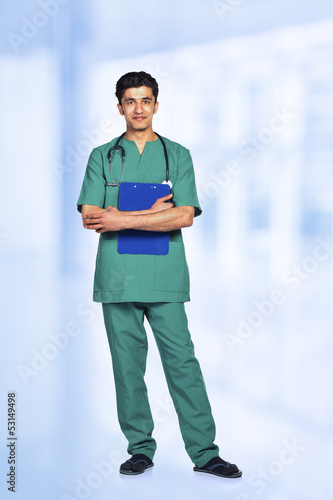 Photo: Portrait of the smiling arab doctor in interior Portrait of the smiling arab doctor in interior