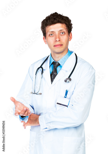 Photo: Portrait of a male doctor showing finger at you on white Portrait of a male doctor showing finger at you on white