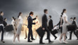 Businessman in blindfold among group of people