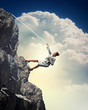 Photo: businesswoman climbing mountain businesswoman climbing mountain