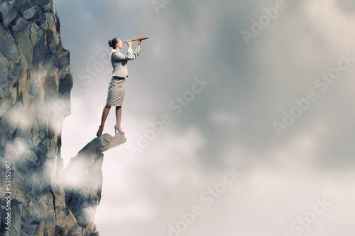 Photo: Business woman with telescope Business woman with telescope