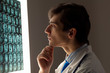 Man doctor looking at x-ray