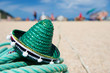 Photo: Green Spanish straw hat at beach Green Spanish straw hat at beach