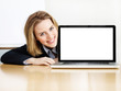 Photo: Business woman presenting her laptop with copyspace Business woman presenting her laptop with copyspace