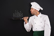 Chef blowing smoke from pan