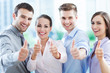 Business team with thumbs up