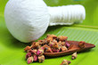 Flower tea rose buds on banana leaves with herbal massage ball