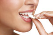 close up on a beautiful girl while enjoying a candy