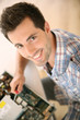 Man fixing electronic appliance