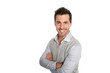 Cheerful man with arms crossed, isolated