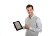 Startup businessman showing tablet screen