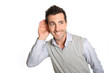 Man on white background listening carefully