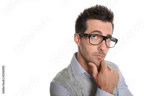 Photo: Thoughtful guy with eyeglasses Thoughtful guy with eyeglasses