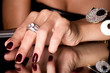 Foto: Hand with golden jewelry on black background Hand with golden jewelry on black background