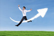 Asian businessman jumping over up arrow sign cloud